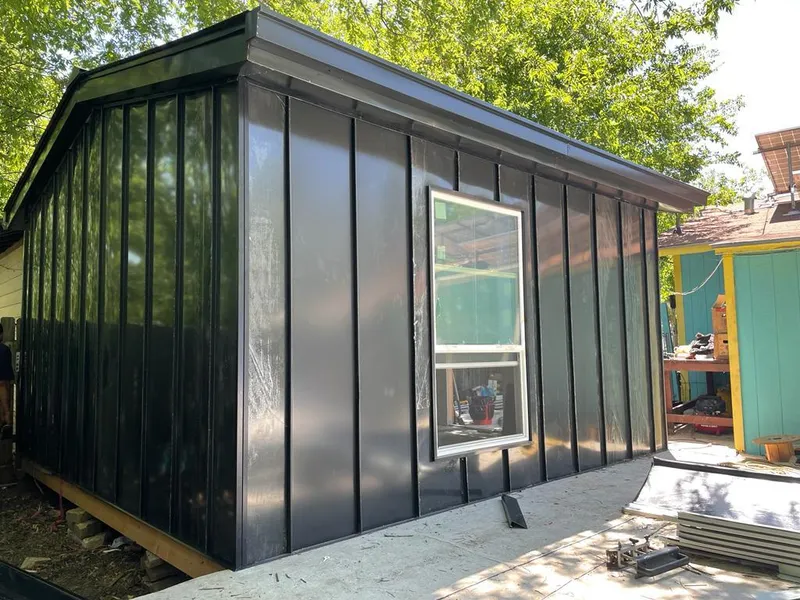 Black standing seam metal wall panels for Roof Inspection in Rendon